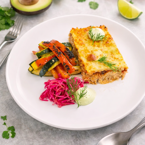 Chicken Enchilada, Pickled Red Onion and Cabbage, Charred Zucchini and Capsicum, Avocado and Sour Cream Sauce