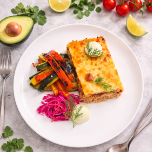 Chicken Enchilada, Pickled Red Onion and Cabbage, Charred Zucchini and Capsicum, Avocado and Sour Cream Sauce